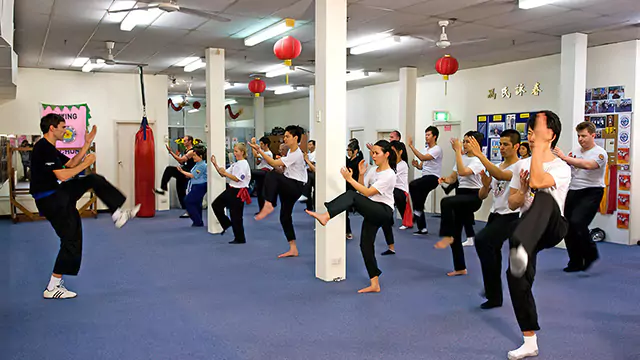 Students warm up for a martial arts class at the International Wing Chun Academy.