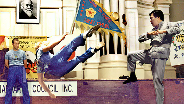 Grandmaster Jim Fung demonstrates a thrust kick at the International Grandmaster's Exhibition in Adelaide, 1988.