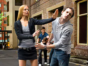 Vlasta demonstrates a 'Cut Down and Punch' against an attacker in a street self-defence scenario.