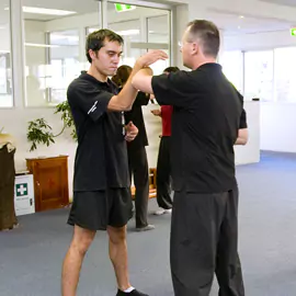 Students practise martial arts together