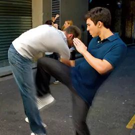 Tristan Fung demonstrates a knee strike in a realistic self-defence scenario