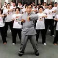 Grandmaster Jim Fung demonstrates the Bong Sau while Michiko Umebayashi (left) and other Certificate IV students follow at the Academy's Sydney HQ, late 1990s.