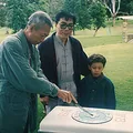 Grandmaster Jim Fung and his son Tristan look on as Sigung Chu Shong Tin cuts the cake at the Academy's 20th anniversary celebration at Centennial Park in Sydney, 1993.
